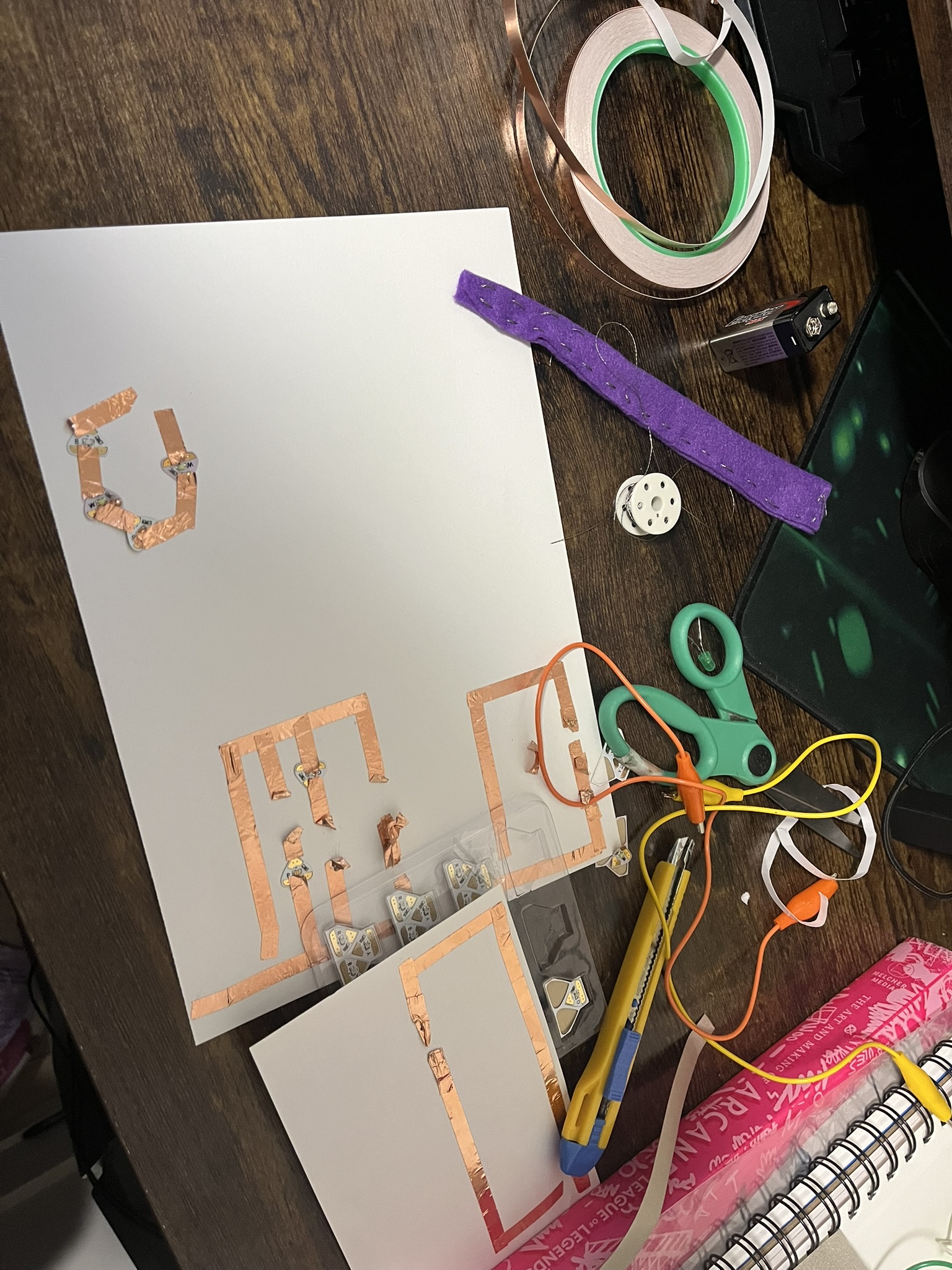 This photo shows the state of my work environment trying to get these circuits working with a variety of materials.