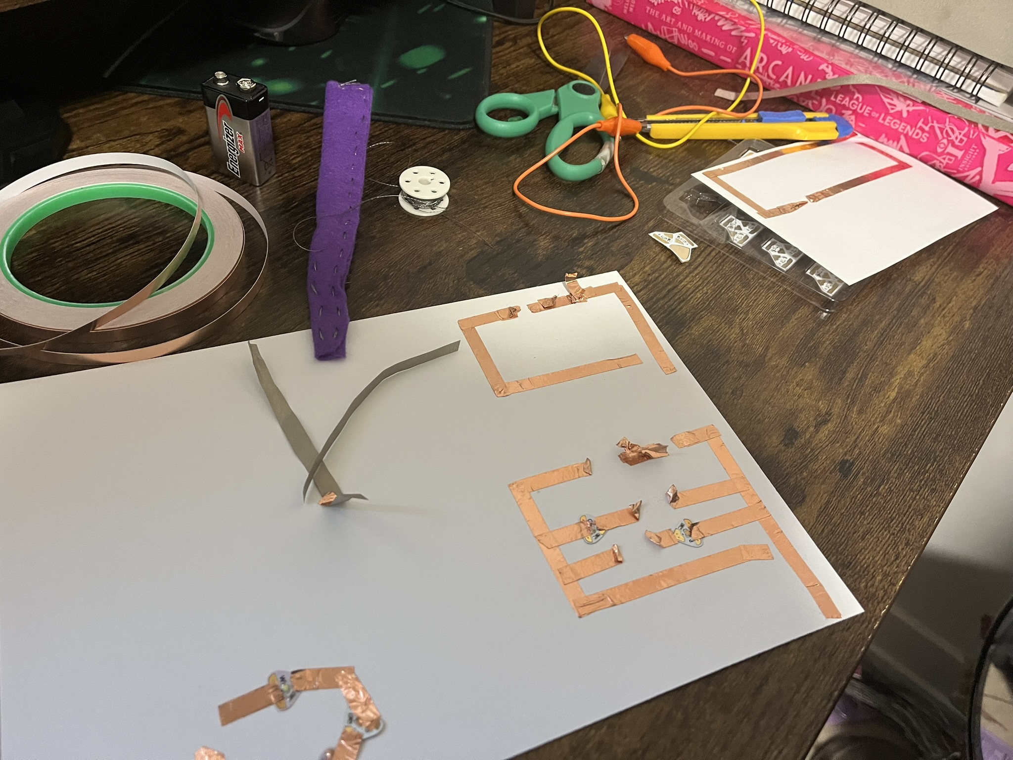 This photo shows the state of my work environment trying to get these circuits working with a variety of materials.