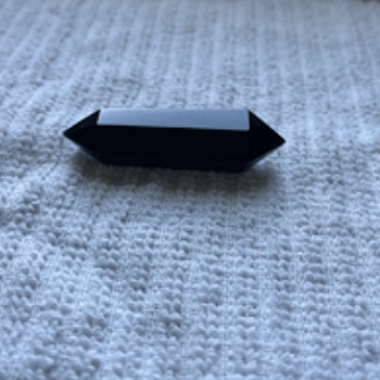 This is an obsidian crystal I have owned for several years, I always keep it on a shelf visible in my room.