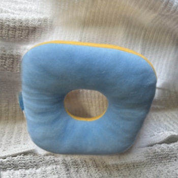 This is my piercing pillow I use it every night to avoid putting pressure on my ears and my ear piercings, I used to wake up with sore ears every day but not anymore!