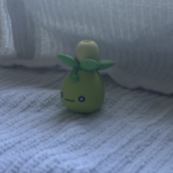 This complex object is an eraser of the Pokemon Smoliv. I bought this with my little sister and really enjoy collecting Pokemon trinkets with her so it makes me happy to see my Pokemon collection.